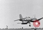 Image of F4U Corsair noses over on landing Pacific Theater, 1943, second 1 stock footage video 65675040837