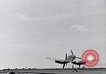 Image of F4U Corsair noses over on landing Pacific Theater, 1943, second 8 stock footage video 65675040837
