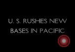 Image of Pacific Islanders in dugout canoes Pacific Theater, 1942, second 18 stock footage video 65675040839