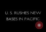 Image of Pacific Islanders in dugout canoes Pacific Theater, 1942, second 19 stock footage video 65675040839