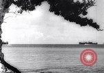 Image of Pacific Islanders in dugout canoes Pacific Theater, 1942, second 24 stock footage video 65675040839