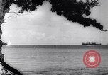 Image of Pacific Islanders in dugout canoes Pacific Theater, 1942, second 25 stock footage video 65675040839