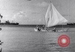Image of Pacific Islanders in dugout canoes Pacific Theater, 1942, second 26 stock footage video 65675040839