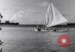 Image of Pacific Islanders in dugout canoes Pacific Theater, 1942, second 29 stock footage video 65675040839
