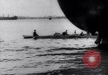 Image of Pacific Islanders in dugout canoes Pacific Theater, 1942, second 30 stock footage video 65675040839