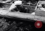 Image of Pacific Islanders in dugout canoes Pacific Theater, 1942, second 33 stock footage video 65675040839