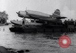 Image of Pacific Islanders in dugout canoes Pacific Theater, 1942, second 46 stock footage video 65675040839