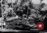 Image of Pacific Islanders in dugout canoes Pacific Theater, 1942, second 59 stock footage video 65675040839