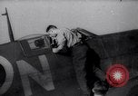Image of British ground crewman assist RAF pilots of Spitfire fighter planes England United Kingdom, 1940, second 1 stock footage video 65675041005