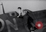 Image of British ground crewman assist RAF pilots of Spitfire fighter planes England United Kingdom, 1940, second 3 stock footage video 65675041005