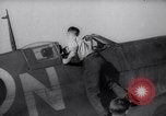 Image of British ground crewman assist RAF pilots of Spitfire fighter planes England United Kingdom, 1940, second 4 stock footage video 65675041005
