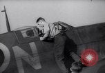 Image of British ground crewman assist RAF pilots of Spitfire fighter planes England United Kingdom, 1940, second 5 stock footage video 65675041005