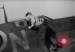 Image of British ground crewman assist RAF pilots of Spitfire fighter planes England United Kingdom, 1940, second 6 stock footage video 65675041005