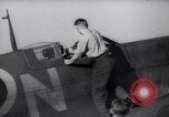 Image of British ground crewman assist RAF pilots of Spitfire fighter planes England United Kingdom, 1940, second 7 stock footage video 65675041005