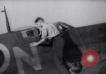 Image of British ground crewman assist RAF pilots of Spitfire fighter planes England United Kingdom, 1940, second 8 stock footage video 65675041005