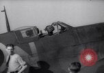 Image of British ground crewman assist RAF pilots of Spitfire fighter planes England United Kingdom, 1940, second 9 stock footage video 65675041005