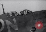 Image of British ground crewman assist RAF pilots of Spitfire fighter planes England United Kingdom, 1940, second 10 stock footage video 65675041005