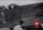 Image of British ground crewman assist RAF pilots of Spitfire fighter planes England United Kingdom, 1940, second 11 stock footage video 65675041005