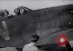 Image of British ground crewman assist RAF pilots of Spitfire fighter planes England United Kingdom, 1940, second 13 stock footage video 65675041005