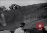 Image of British ground crewman assist RAF pilots of Spitfire fighter planes England United Kingdom, 1940, second 15 stock footage video 65675041005