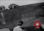 Image of British ground crewman assist RAF pilots of Spitfire fighter planes England United Kingdom, 1940, second 16 stock footage video 65675041005