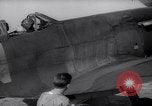 Image of British ground crewman assist RAF pilots of Spitfire fighter planes England United Kingdom, 1940, second 17 stock footage video 65675041005