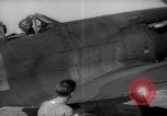 Image of British ground crewman assist RAF pilots of Spitfire fighter planes England United Kingdom, 1940, second 18 stock footage video 65675041005