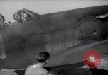 Image of British ground crewman assist RAF pilots of Spitfire fighter planes England United Kingdom, 1940, second 19 stock footage video 65675041005