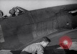 Image of British ground crewman assist RAF pilots of Spitfire fighter planes England United Kingdom, 1940, second 20 stock footage video 65675041005