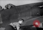 Image of British ground crewman assist RAF pilots of Spitfire fighter planes England United Kingdom, 1940, second 21 stock footage video 65675041005