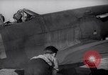 Image of British ground crewman assist RAF pilots of Spitfire fighter planes England United Kingdom, 1940, second 22 stock footage video 65675041005