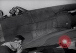 Image of British ground crewman assist RAF pilots of Spitfire fighter planes England United Kingdom, 1940, second 23 stock footage video 65675041005
