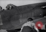 Image of British ground crewman assist RAF pilots of Spitfire fighter planes England United Kingdom, 1940, second 24 stock footage video 65675041005