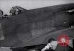 Image of British ground crewman assist RAF pilots of Spitfire fighter planes England United Kingdom, 1940, second 25 stock footage video 65675041005