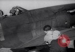 Image of British ground crewman assist RAF pilots of Spitfire fighter planes England United Kingdom, 1940, second 26 stock footage video 65675041005