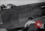 Image of British ground crewman assist RAF pilots of Spitfire fighter planes England United Kingdom, 1940, second 27 stock footage video 65675041005