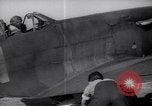 Image of British ground crewman assist RAF pilots of Spitfire fighter planes England United Kingdom, 1940, second 28 stock footage video 65675041005