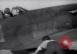 Image of British ground crewman assist RAF pilots of Spitfire fighter planes England United Kingdom, 1940, second 29 stock footage video 65675041005