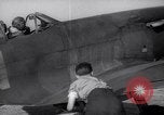 Image of British ground crewman assist RAF pilots of Spitfire fighter planes England United Kingdom, 1940, second 31 stock footage video 65675041005