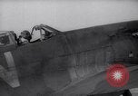 Image of British ground crewman assist RAF pilots of Spitfire fighter planes England United Kingdom, 1940, second 34 stock footage video 65675041005