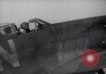 Image of British ground crewman assist RAF pilots of Spitfire fighter planes England United Kingdom, 1940, second 35 stock footage video 65675041005
