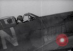 Image of British ground crewman assist RAF pilots of Spitfire fighter planes England United Kingdom, 1940, second 36 stock footage video 65675041005