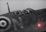 Image of British ground crewman assist RAF pilots of Spitfire fighter planes England United Kingdom, 1940, second 37 stock footage video 65675041005