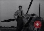 Image of British ground crewman assist RAF pilots of Spitfire fighter planes England United Kingdom, 1940, second 41 stock footage video 65675041005