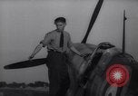 Image of British ground crewman assist RAF pilots of Spitfire fighter planes England United Kingdom, 1940, second 42 stock footage video 65675041005