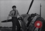 Image of British ground crewman assist RAF pilots of Spitfire fighter planes England United Kingdom, 1940, second 43 stock footage video 65675041005