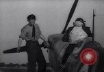 Image of British ground crewman assist RAF pilots of Spitfire fighter planes England United Kingdom, 1940, second 44 stock footage video 65675041005