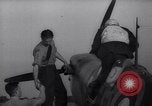 Image of British ground crewman assist RAF pilots of Spitfire fighter planes England United Kingdom, 1940, second 45 stock footage video 65675041005
