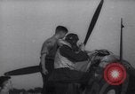 Image of British ground crewman assist RAF pilots of Spitfire fighter planes England United Kingdom, 1940, second 46 stock footage video 65675041005