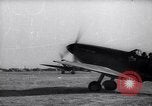 Image of British ground crewman assist RAF pilots of Spitfire fighter planes England United Kingdom, 1940, second 47 stock footage video 65675041005